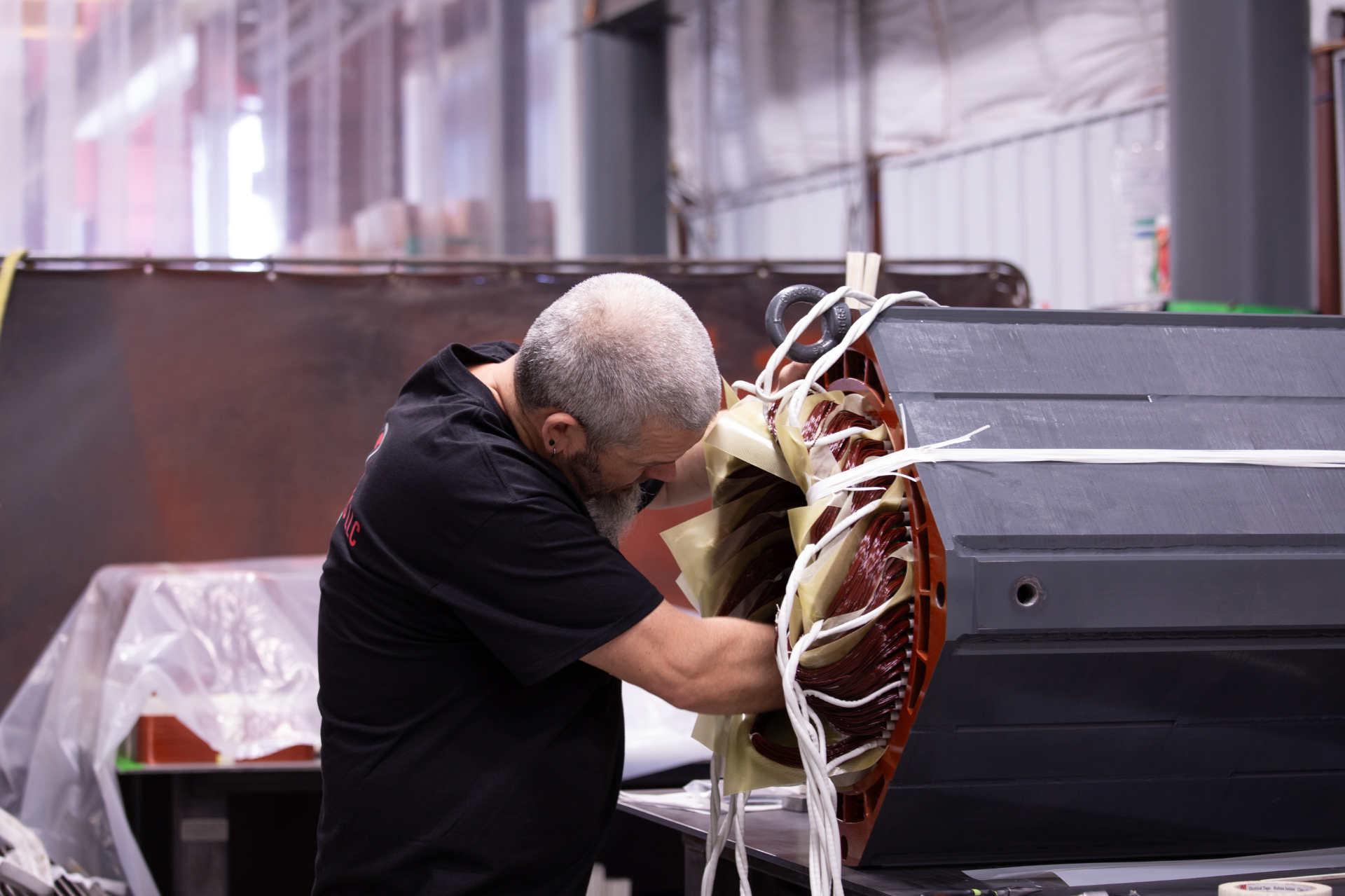 Sidewinders technician inspecting a stator winding on the shop floor